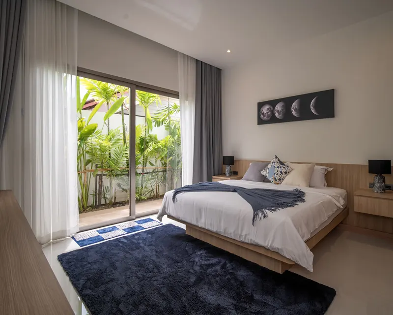 Bedroom with a double bed and sliding glass doors to the garden
