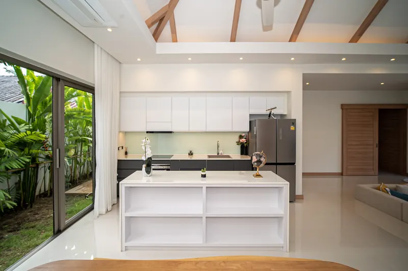Modern open-plan kitchen with an island and garden views